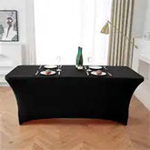 Black stretch tablecloth covering a rectangular table.
